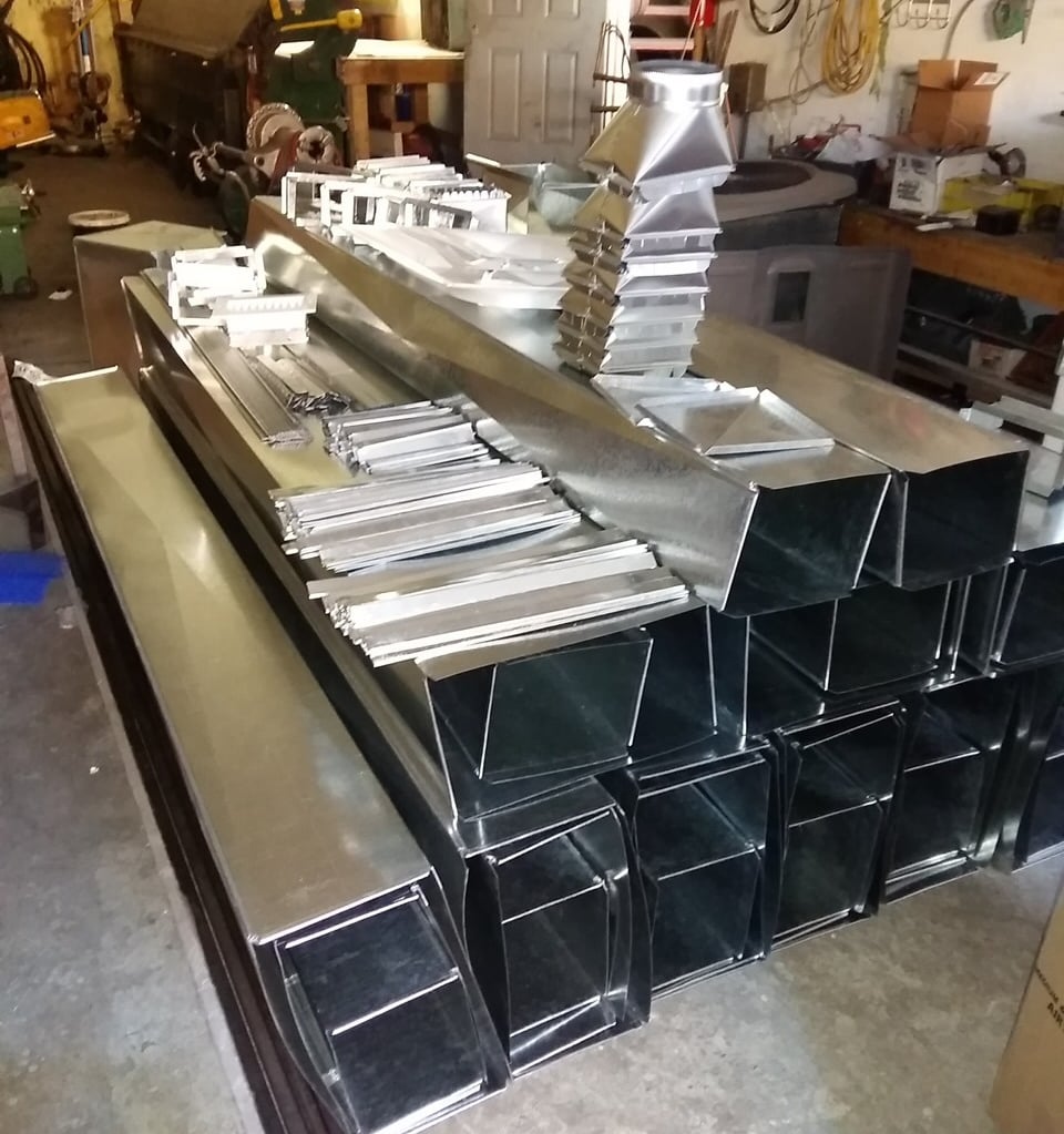 a bunch of metal ducts designed and crafted by bystrom industries