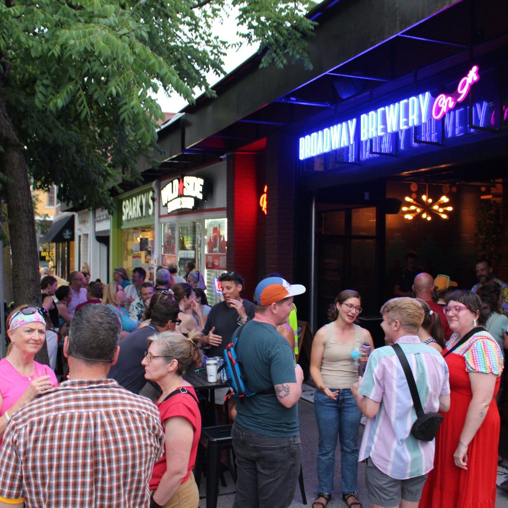 Large group gathered in front of Broadway Brewery