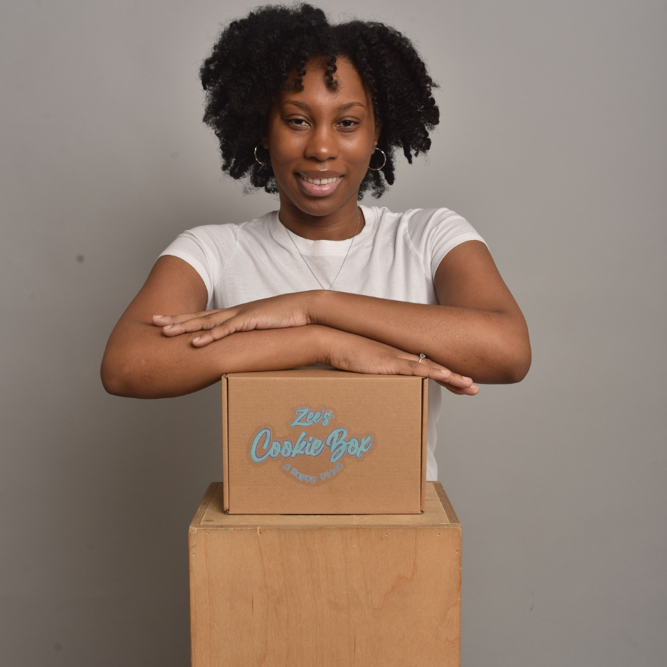 beautiful black woman smiling with cookies