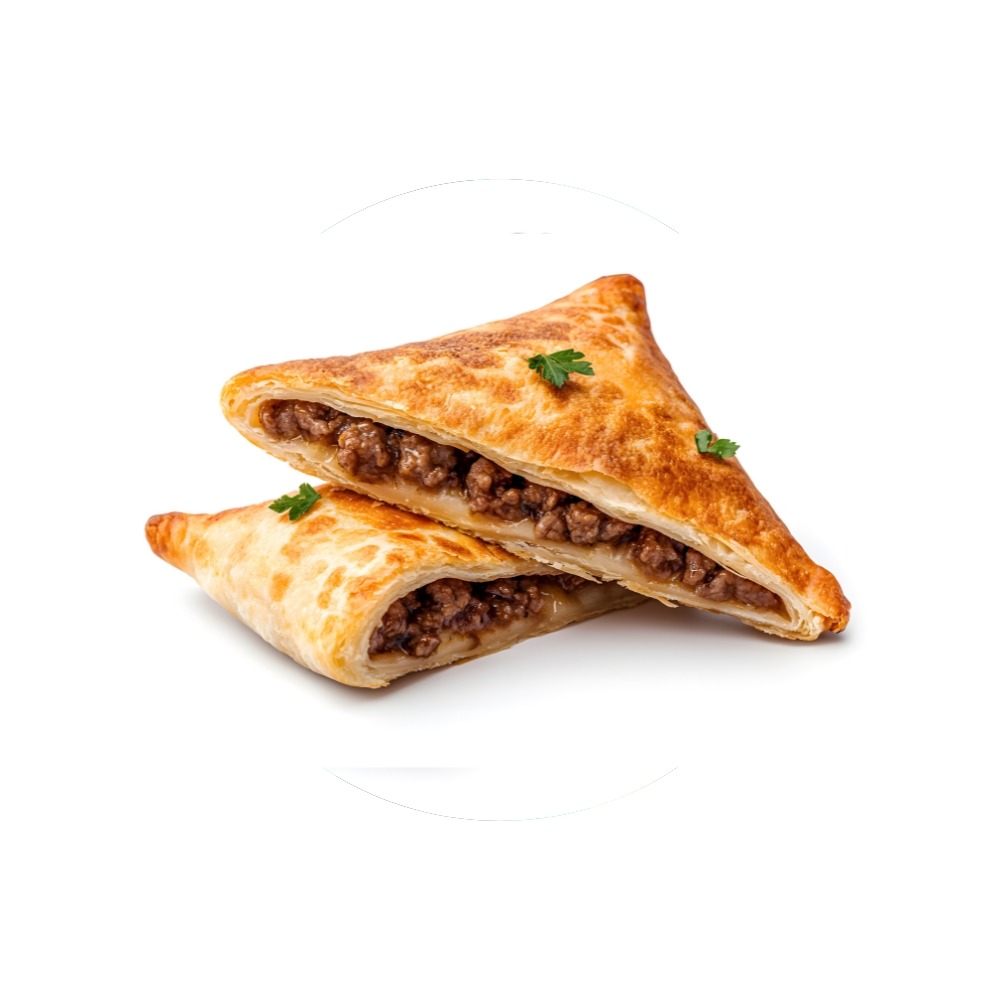 Golden fried lukhmi pastry cut open showing minced meat filling