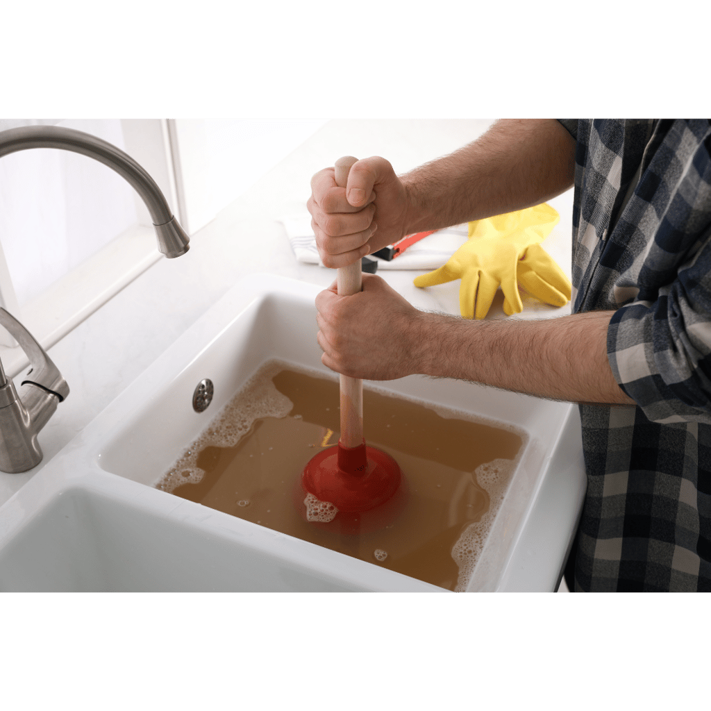 Plumber Unclogging and cleaning drain