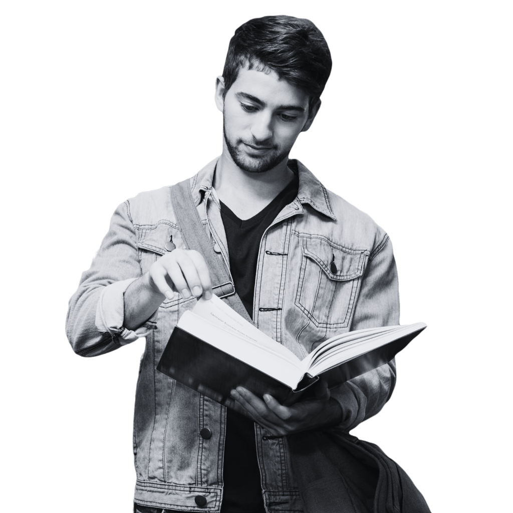 A man reading a book he is holding open