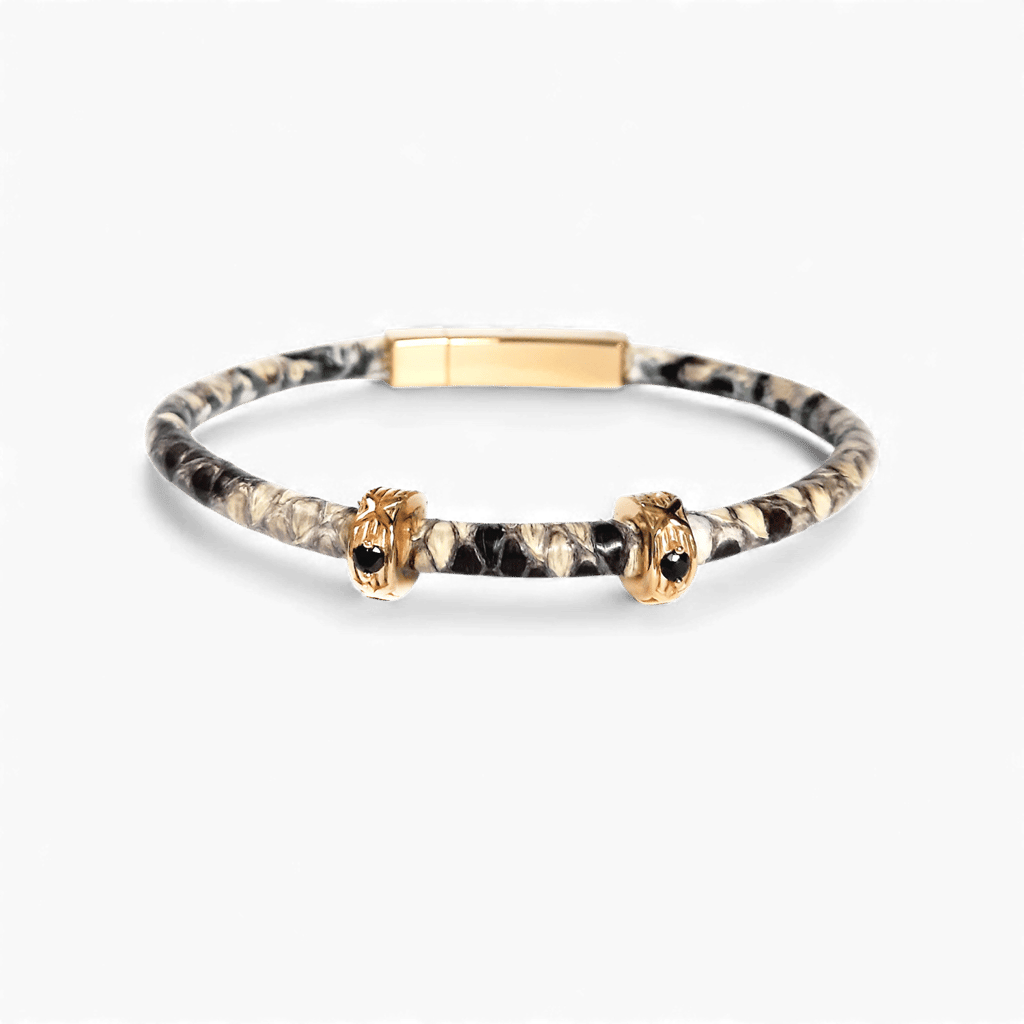 a snakeskin bracelet with a golden clasp