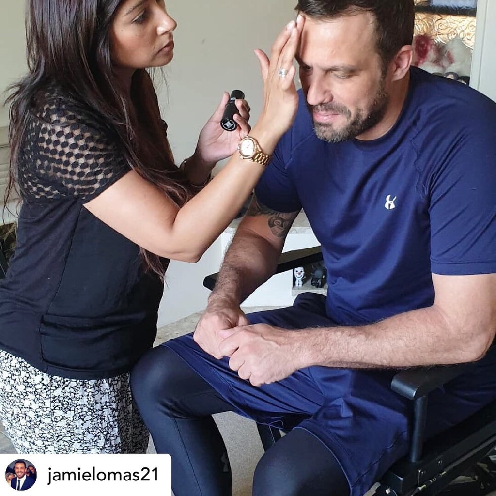 a male actor in a makeup chair is getting a makeover for a film