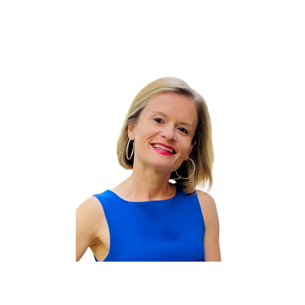 Portrait if Laura Burtan, the founder of Meditation for Change, wearing a royal blue dress. 