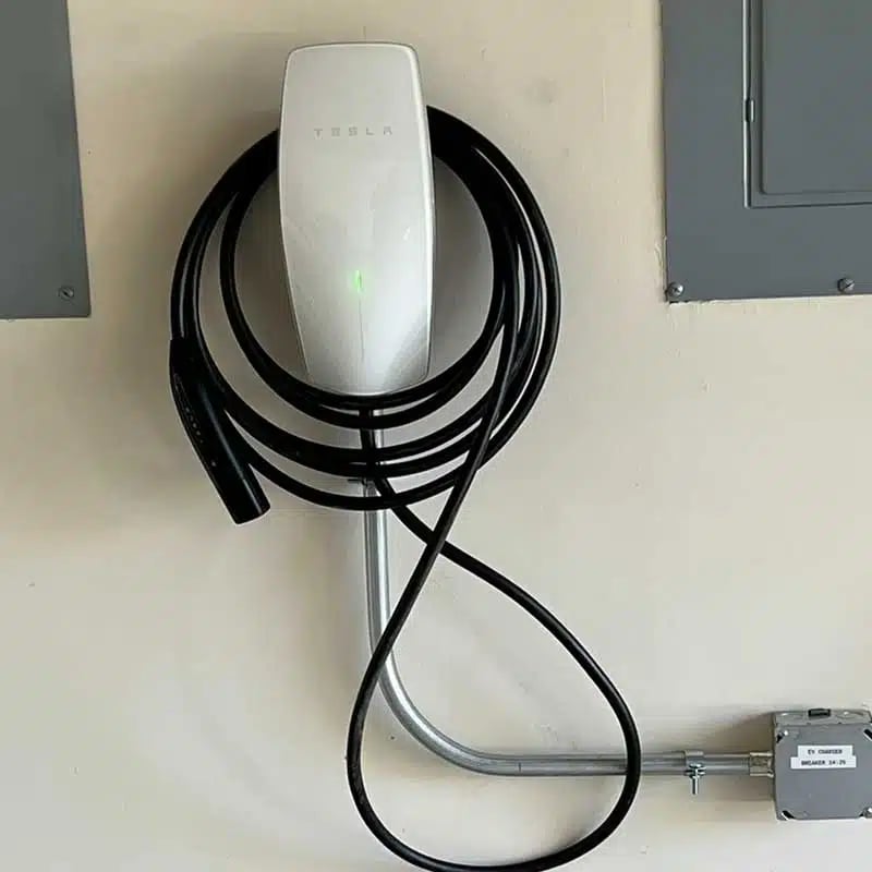 D.A. Electric technician installing EV charging station Kansas City