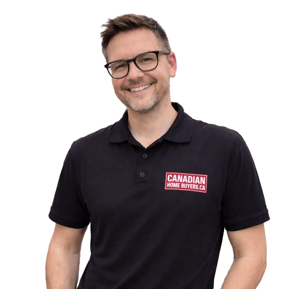 A smiling male real estate professional wearing a Canadian Home Buyers polo shirt.
