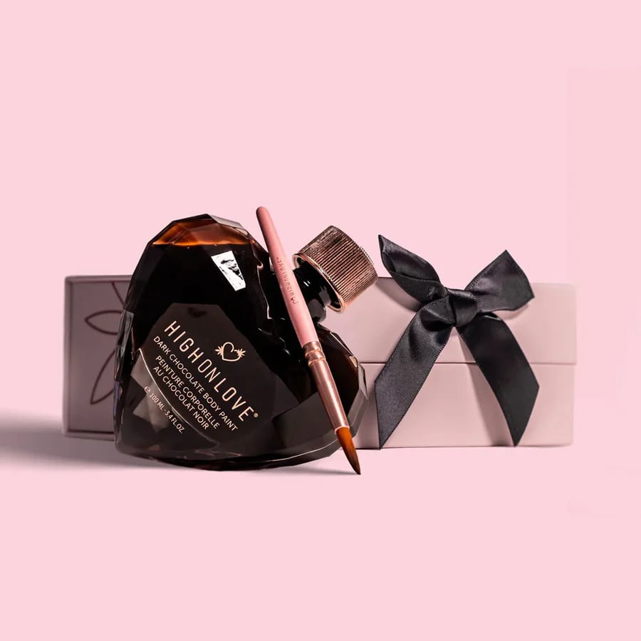 The photo shows a HighOnLove product  - a chocolate body paint, packaged in a crystal glass heart. 