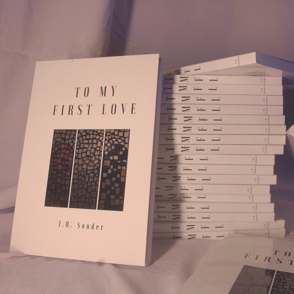 A stack of J.R. Sonder's poetry book, To My First Love (TMFL)