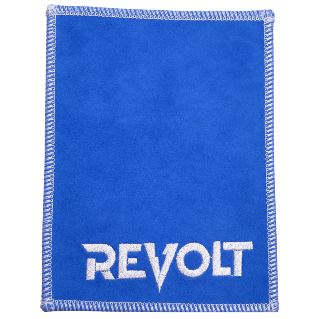Revolt brand blue leather cleaning cloth with white embroidered logo and stitched edges.