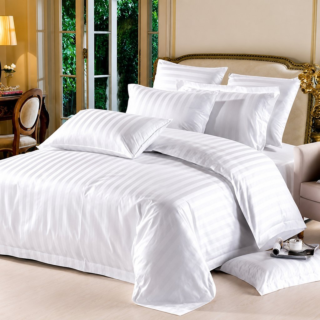 Luxury bed linen collection featuring elegant bedsheets, soft pillows, duvet covers, mattress