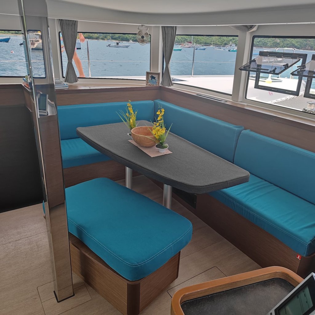 Comfortable air-conditioned interior lounge of private catamaran in Papagayo Gulf