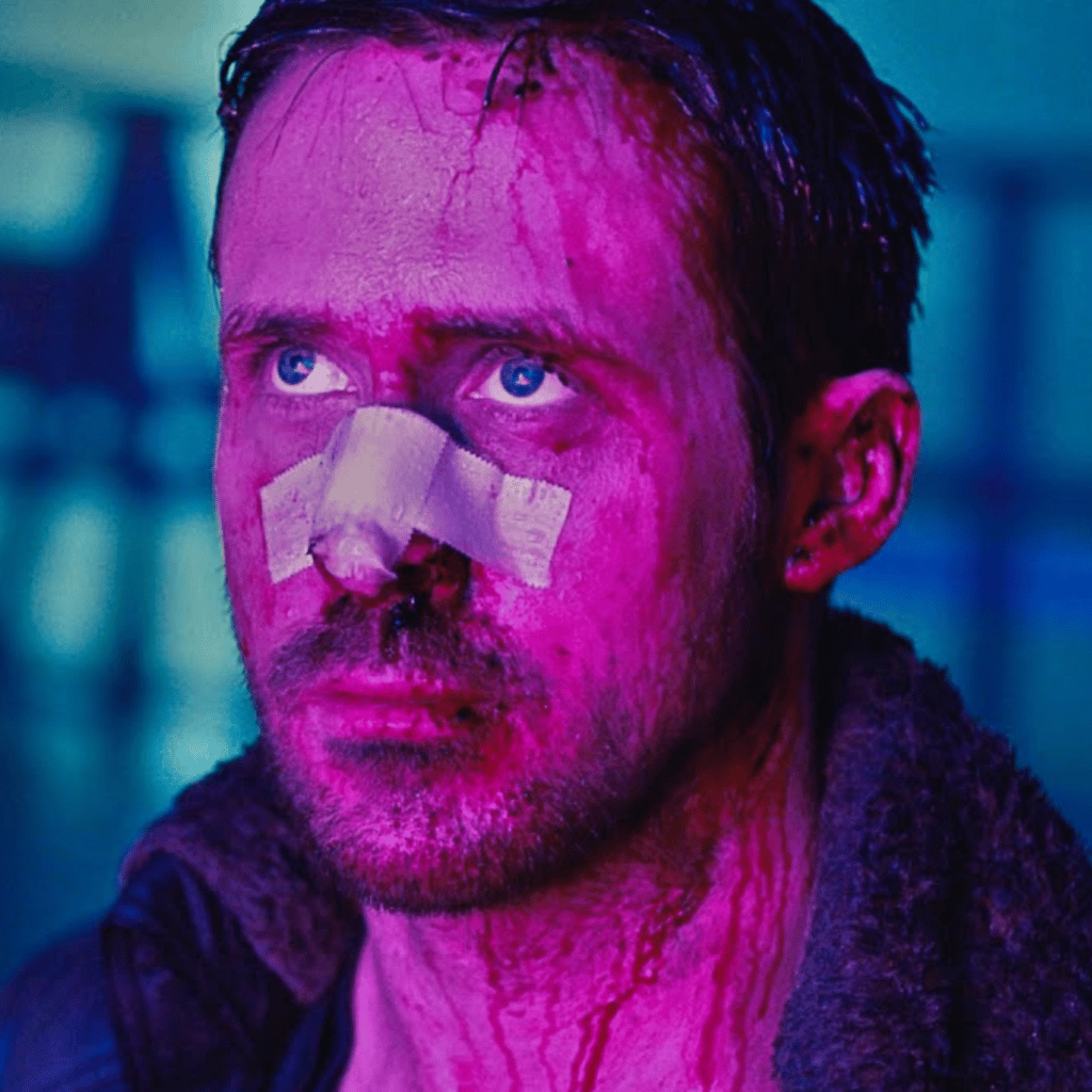 a woman in a black and white suit and red eye makeup