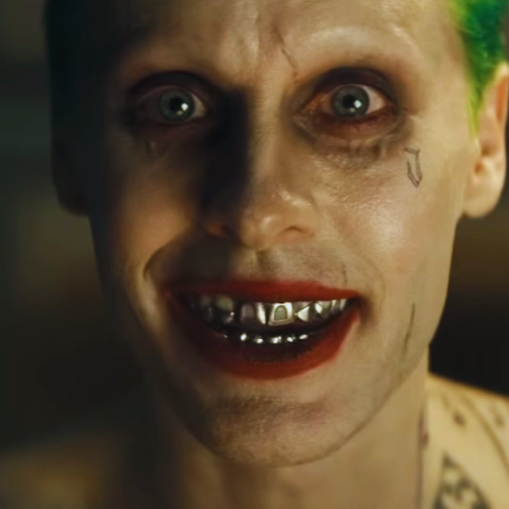 a man with green hair and a green and white shirt