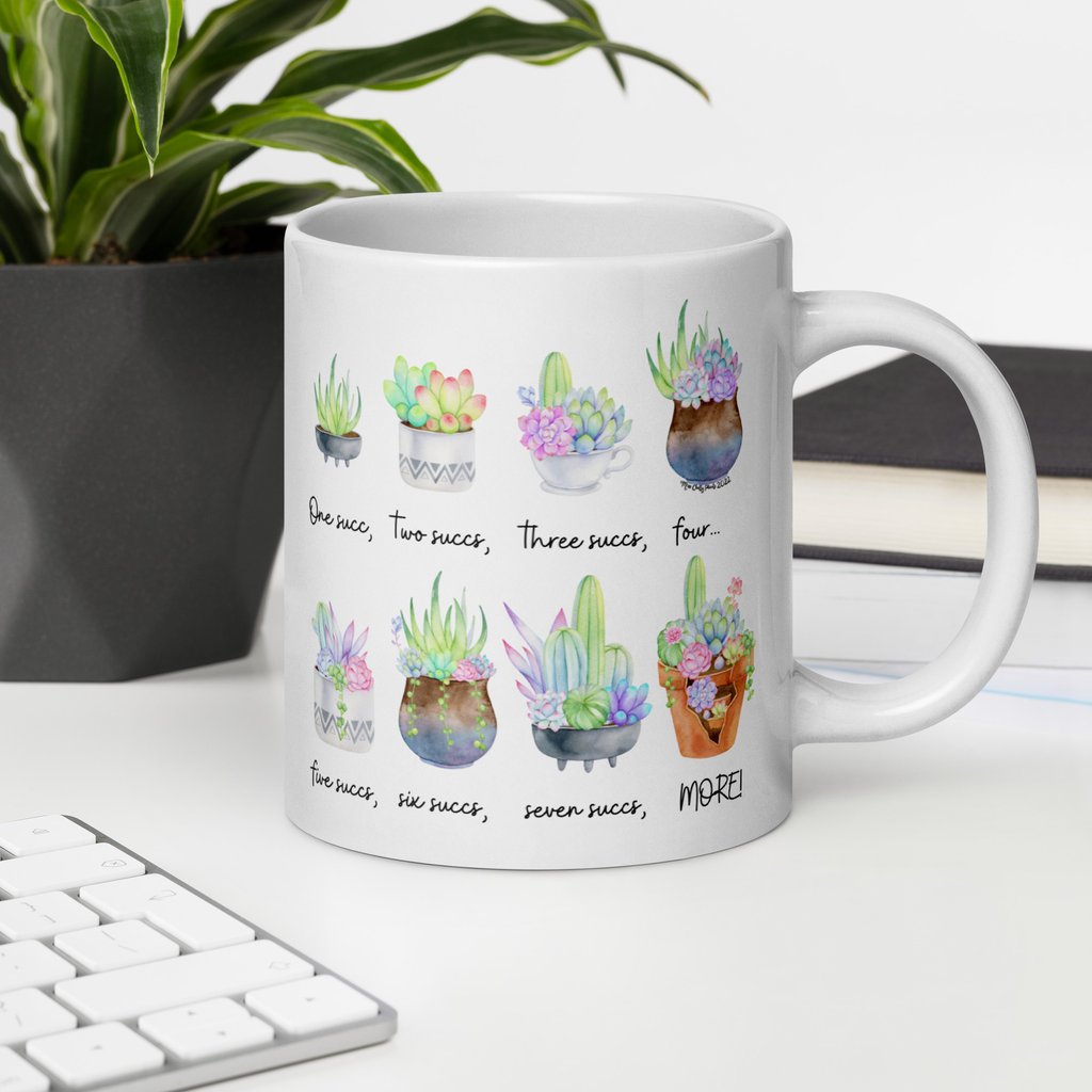 White succulent-themed ceramic mug with colorful plant illustrations — Miss Chatty Plants drinkware collection.