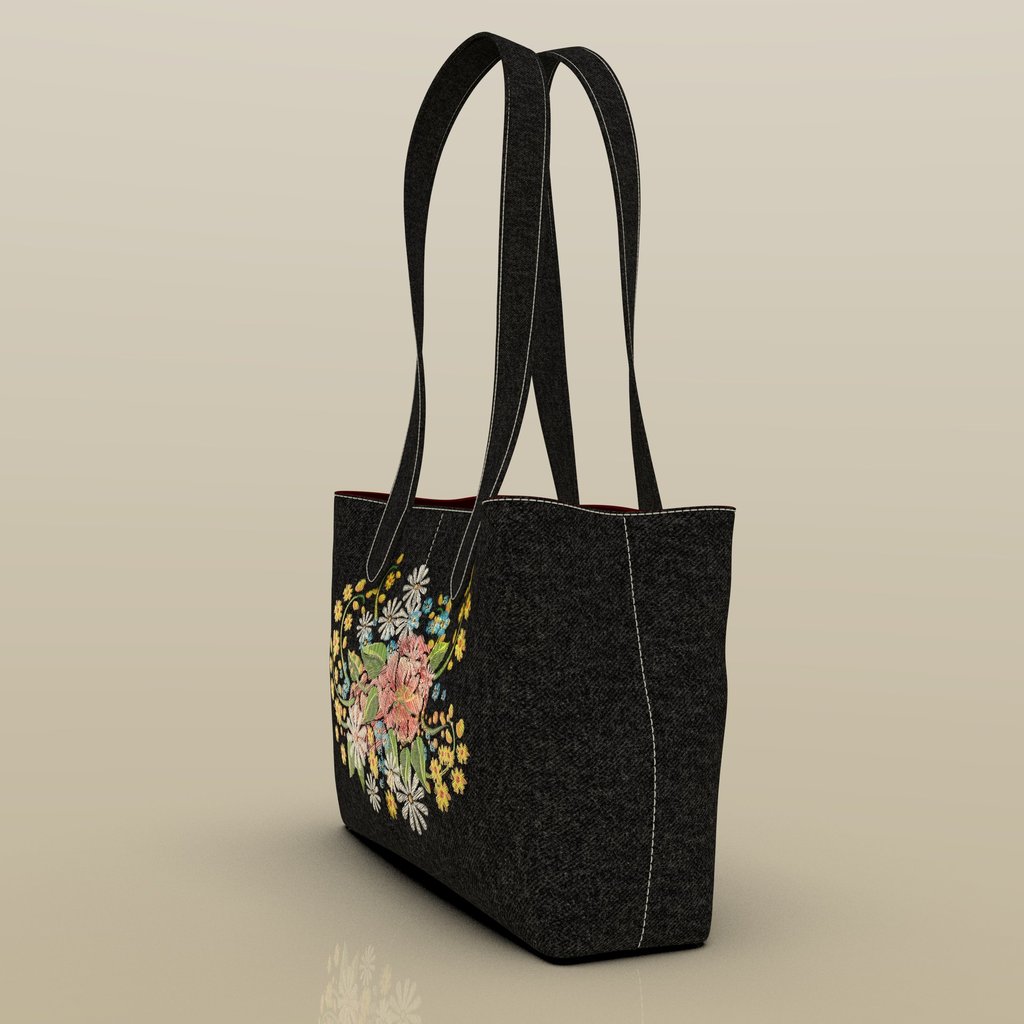 ide view of embroidered fashion bag by Cavity Studios showing premium material finish.