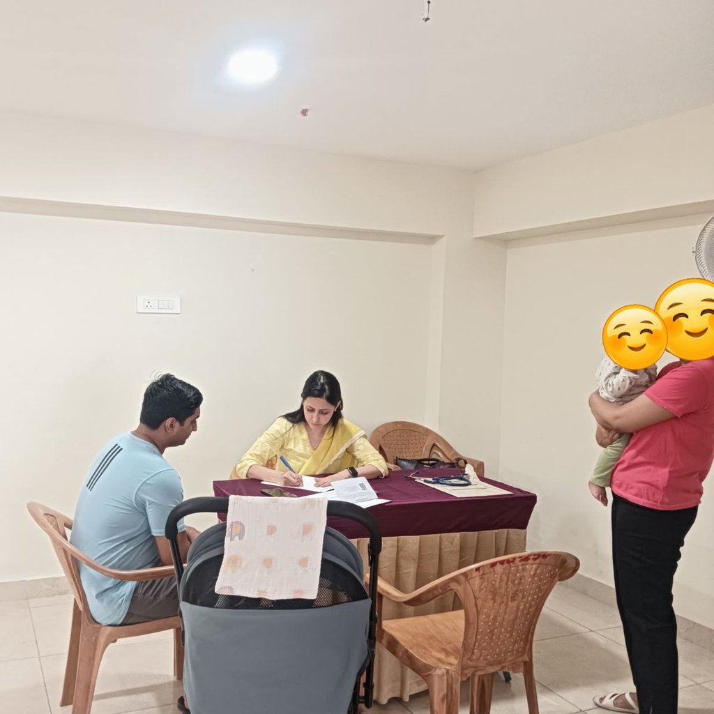 a man and woman sitting at a table with emoticions