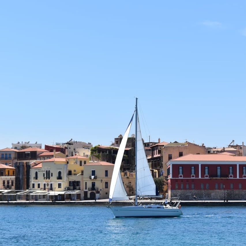 a sailboat in the water in the chania port