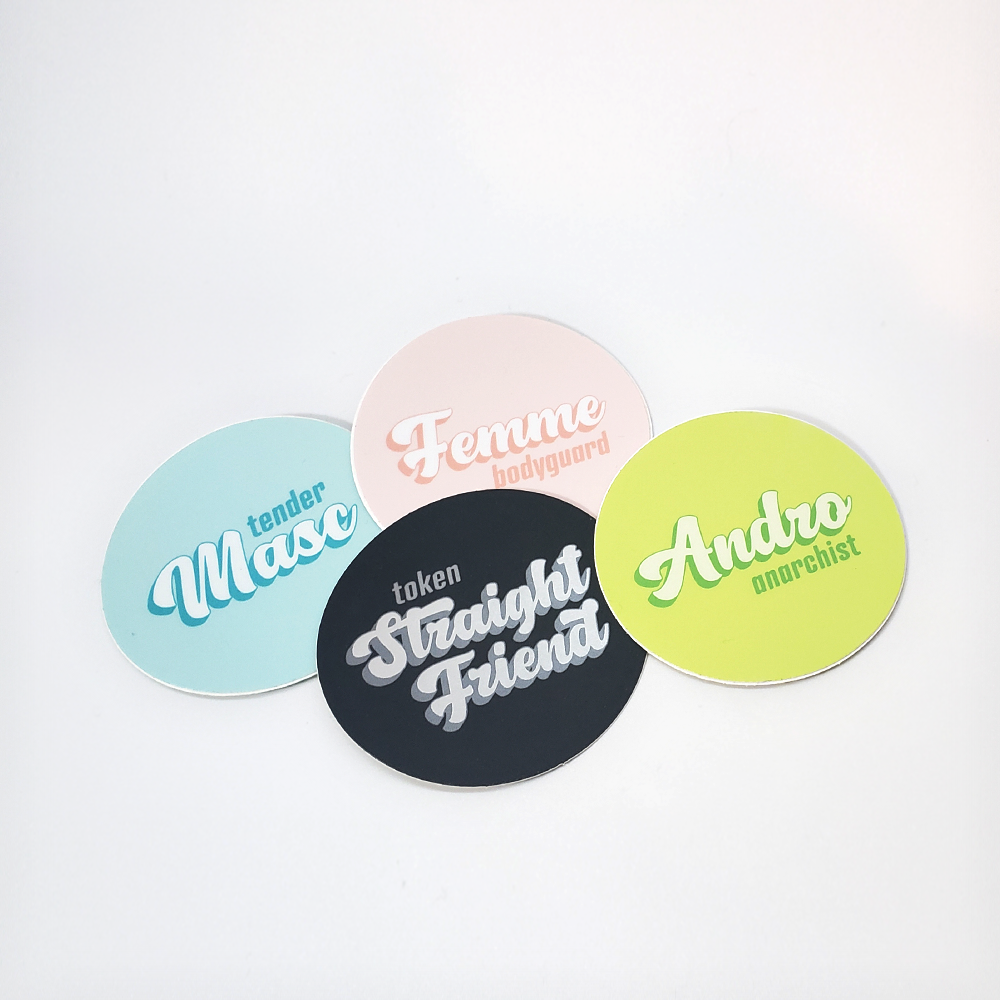 a pile of four stickers with queer identity themes