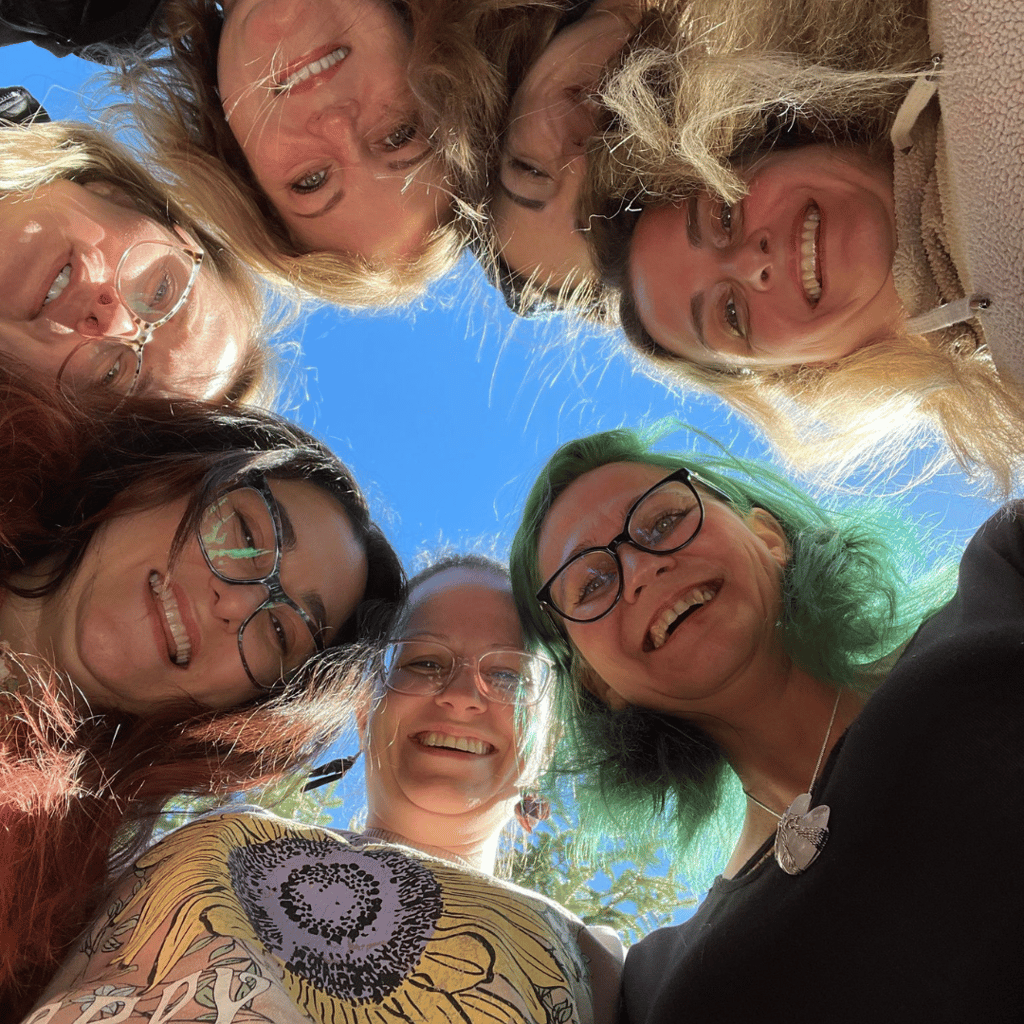 a group of women standing in a circle
