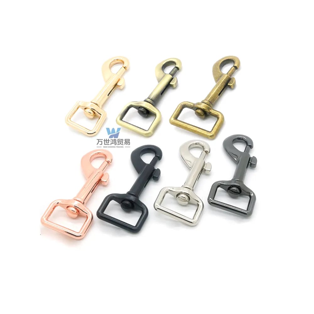 A collection of colorful swivel snap hooks for bag straps in gold, bronze, and silver finishes.