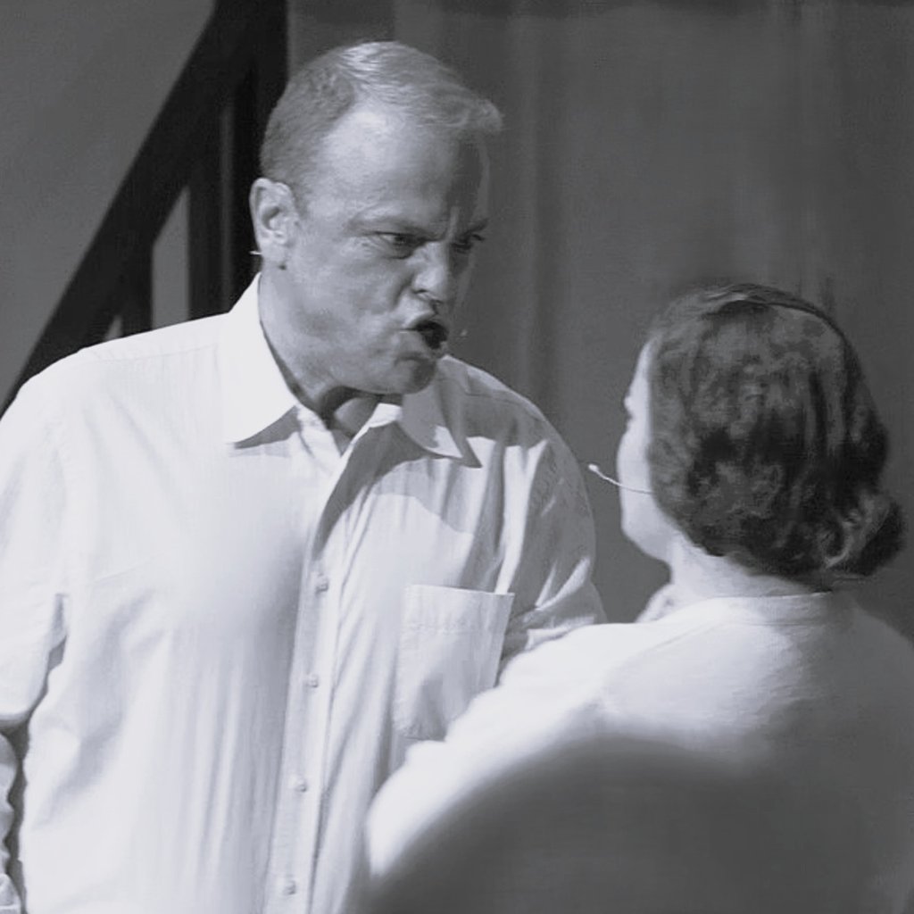 An angry man confronting Young Catherine.