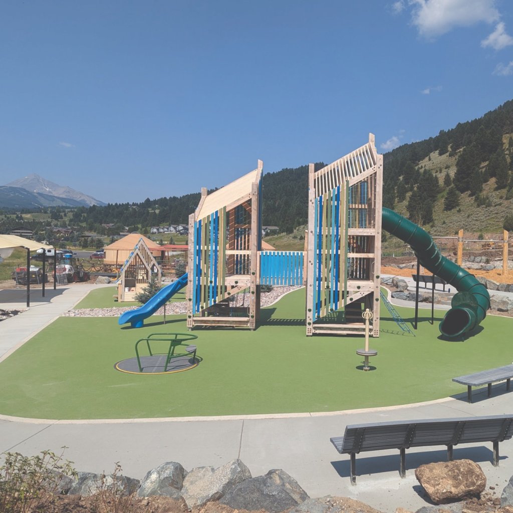 a playground with a slider and a slider