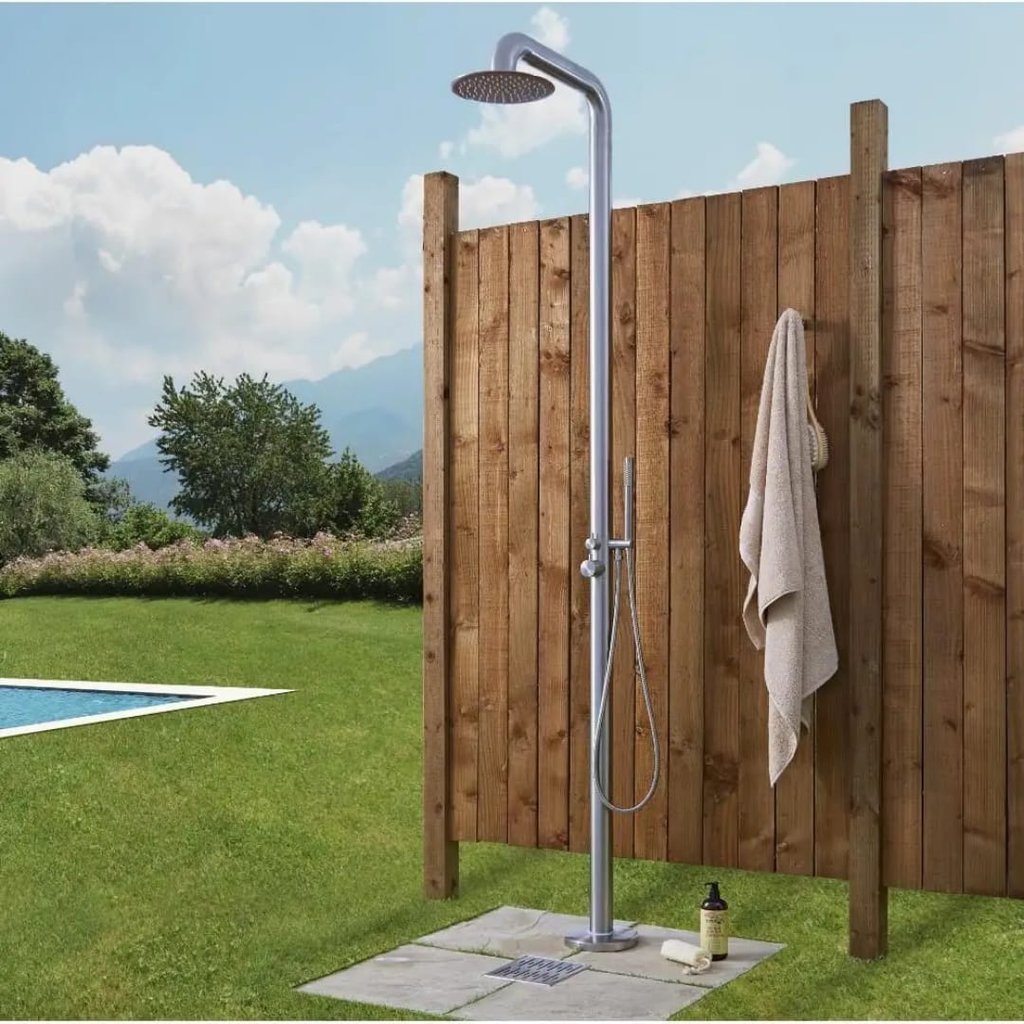 a shower with a shower head and a towel
