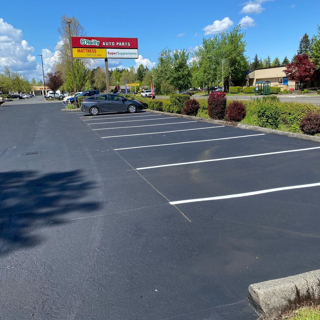 Parking lot sealcoating and striping OReilly Auto Parts Thurston County WA