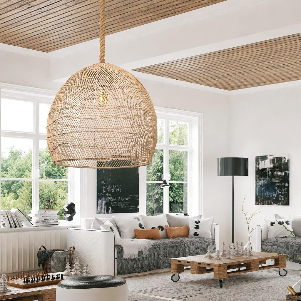 Bohemian living room featuring a large woven rattan pendant light and rustic wood pallet coffee table.