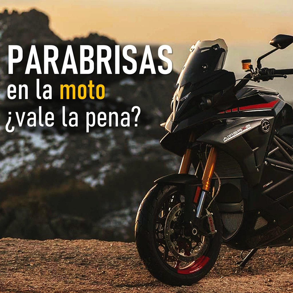 a motorcycle parked on a hill with a mountain in the background