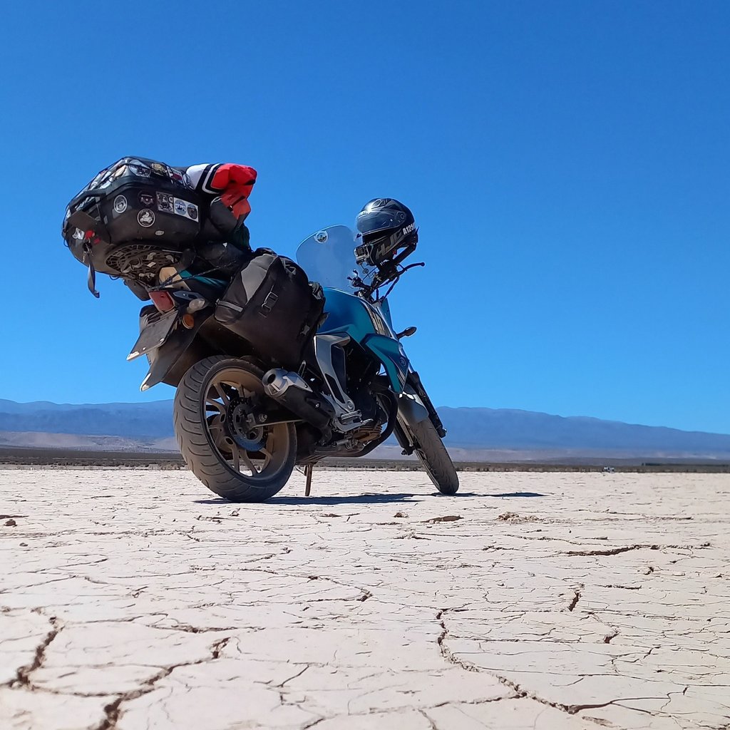 a motorcycle rider's helmet on a desert