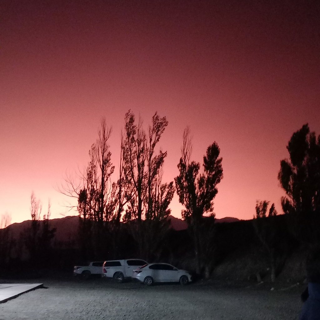 a car parked in a parking lot at night