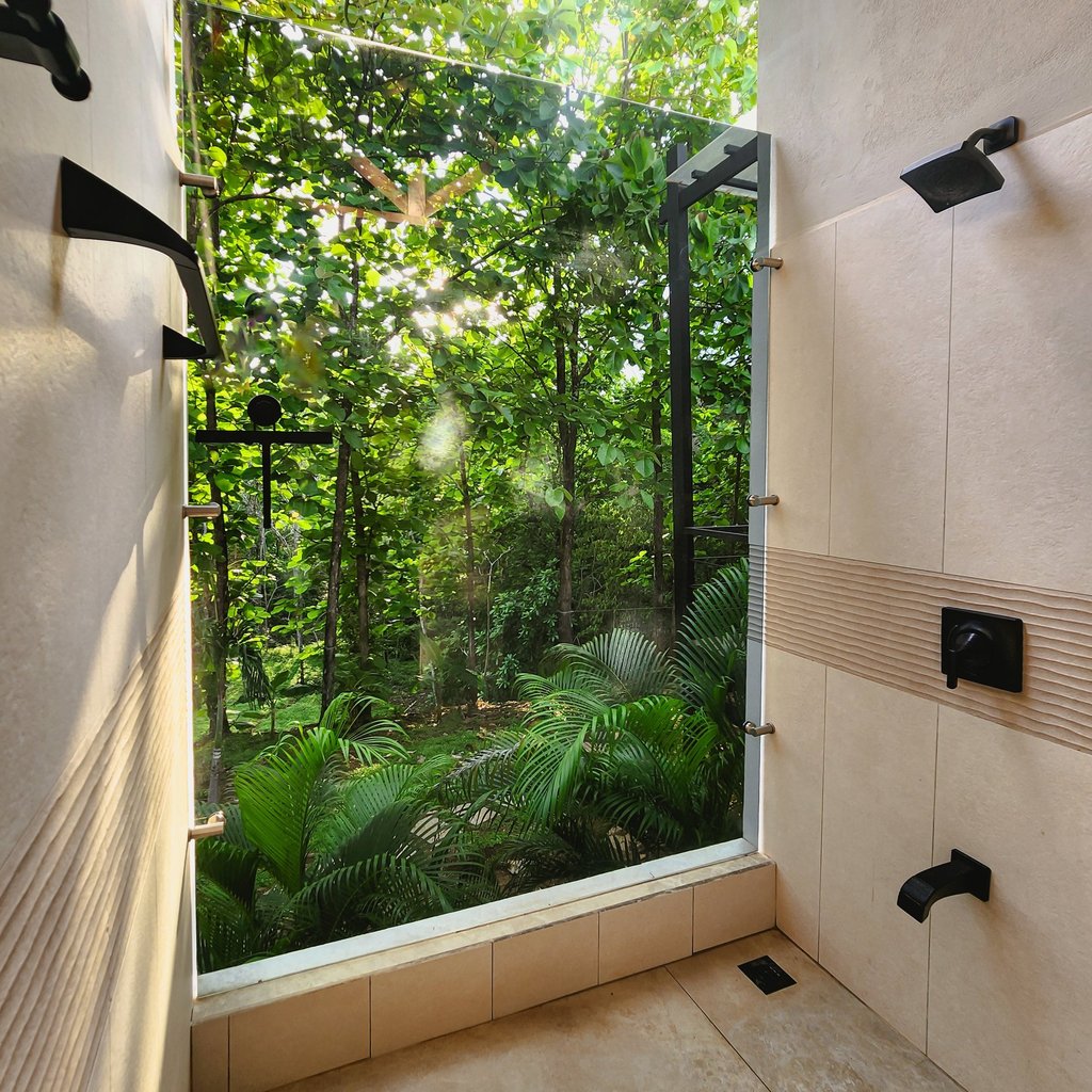 a bathroom with a large window and a view