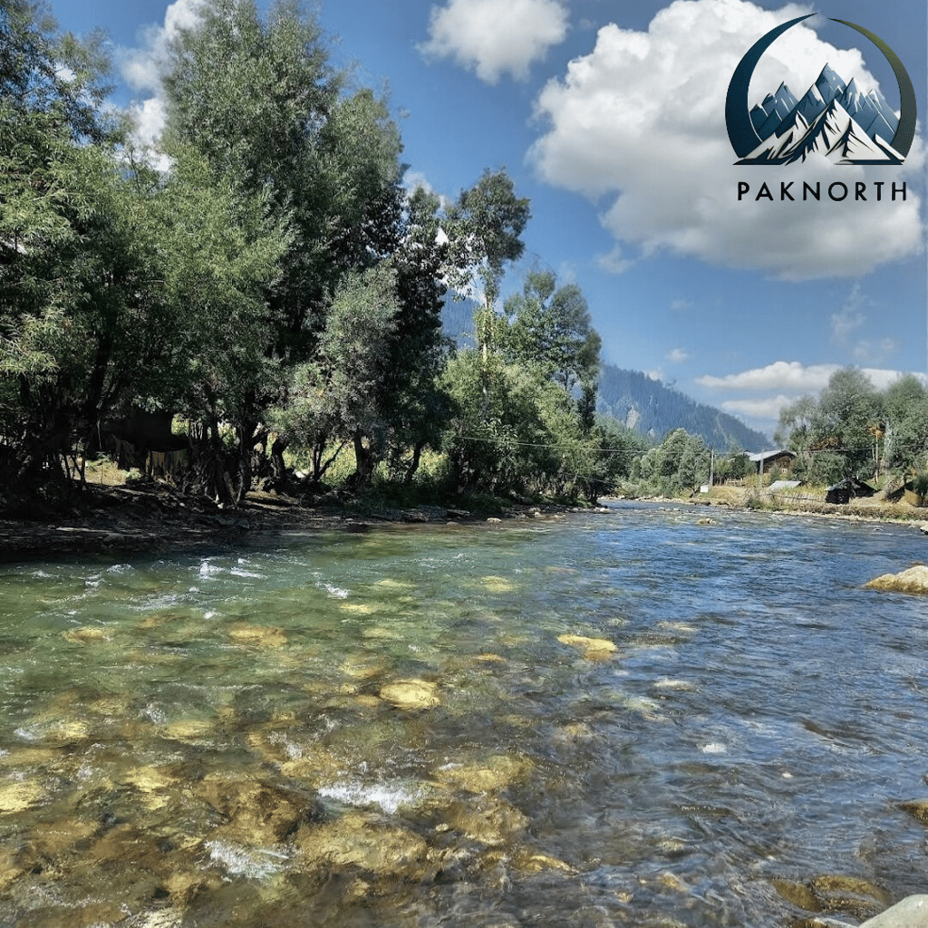 a kunhar river with Himalayan mountains in the background
