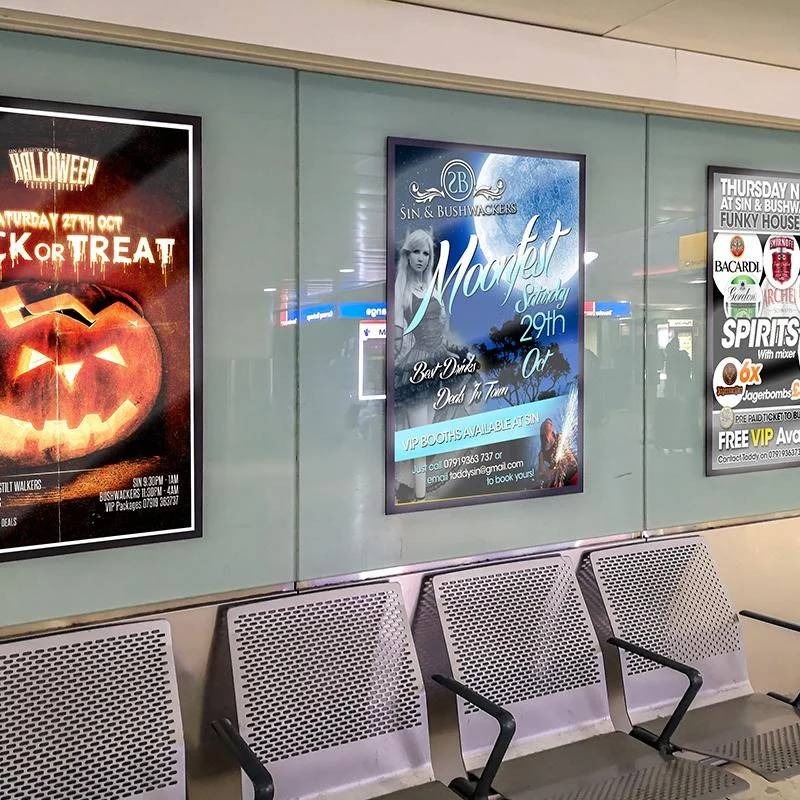 Nightclub event poster displayed at a bus station in large format.