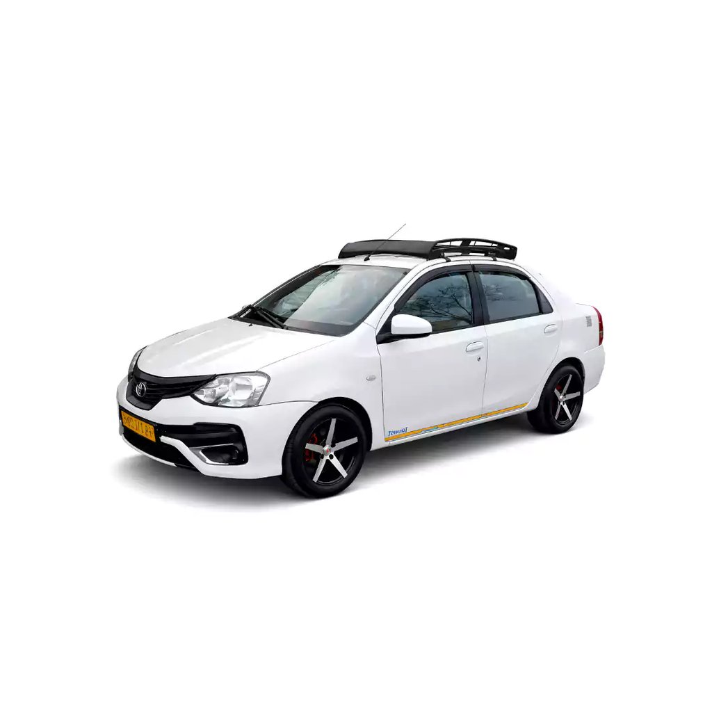 White Toyota Etios one way taxi by Saini taxi services with a luggage carrier rack