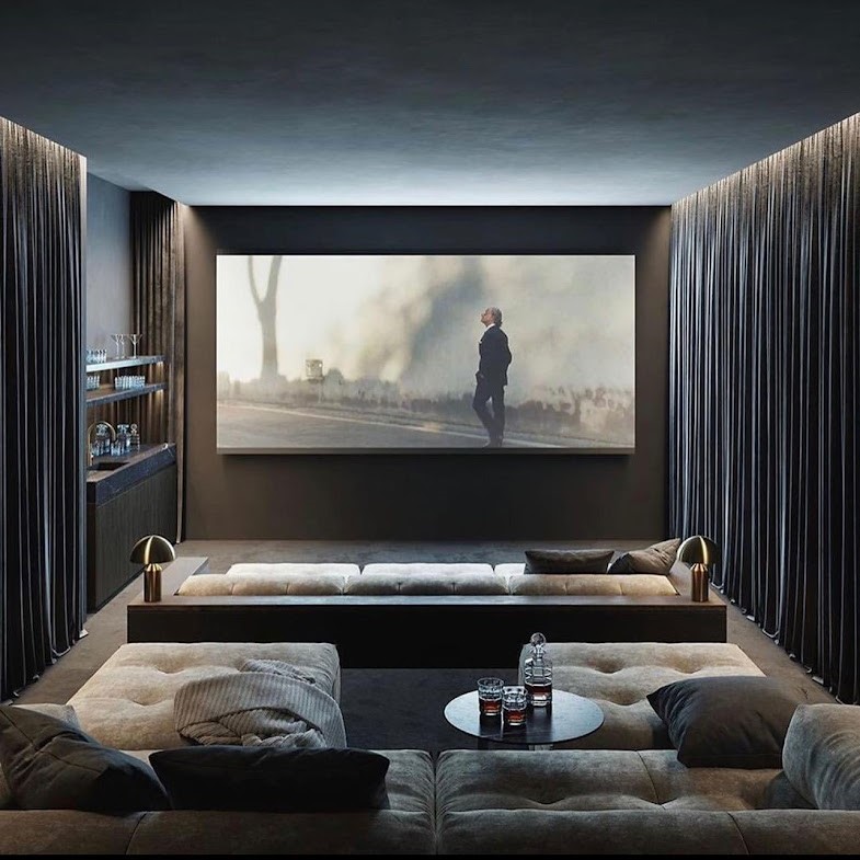 Bespoke London home cinema with tiered seating, starlight ceiling, and Dolby Atmos speakers