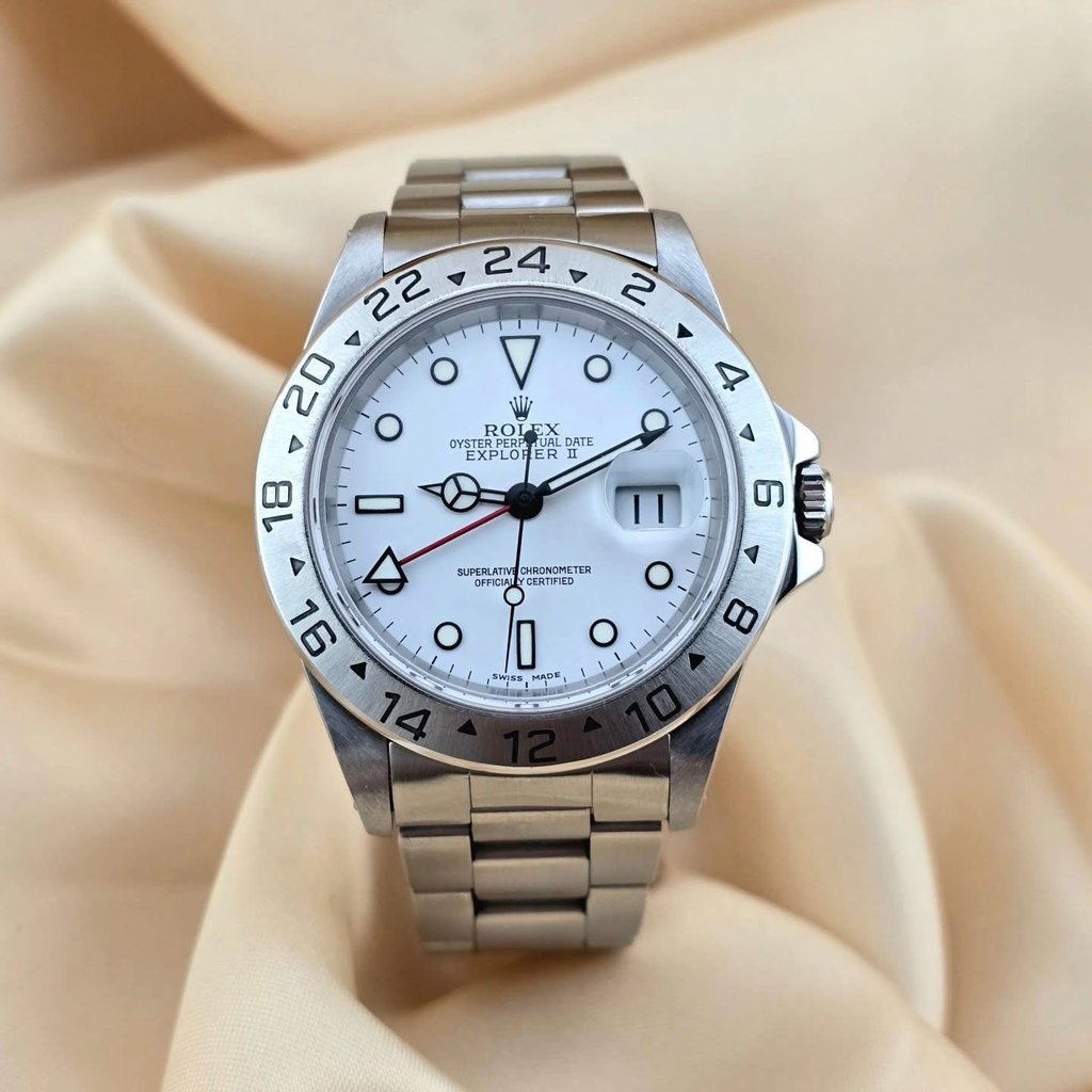Luxury Rolex Explorer II luxury watch with a white polar dial and stainless steel oyster bracelet.