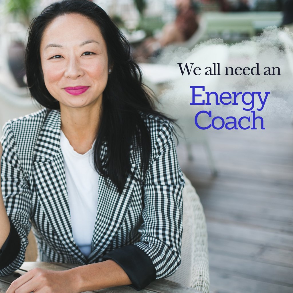 elisa choy in a professional casual jacket smiling and sitting at a table