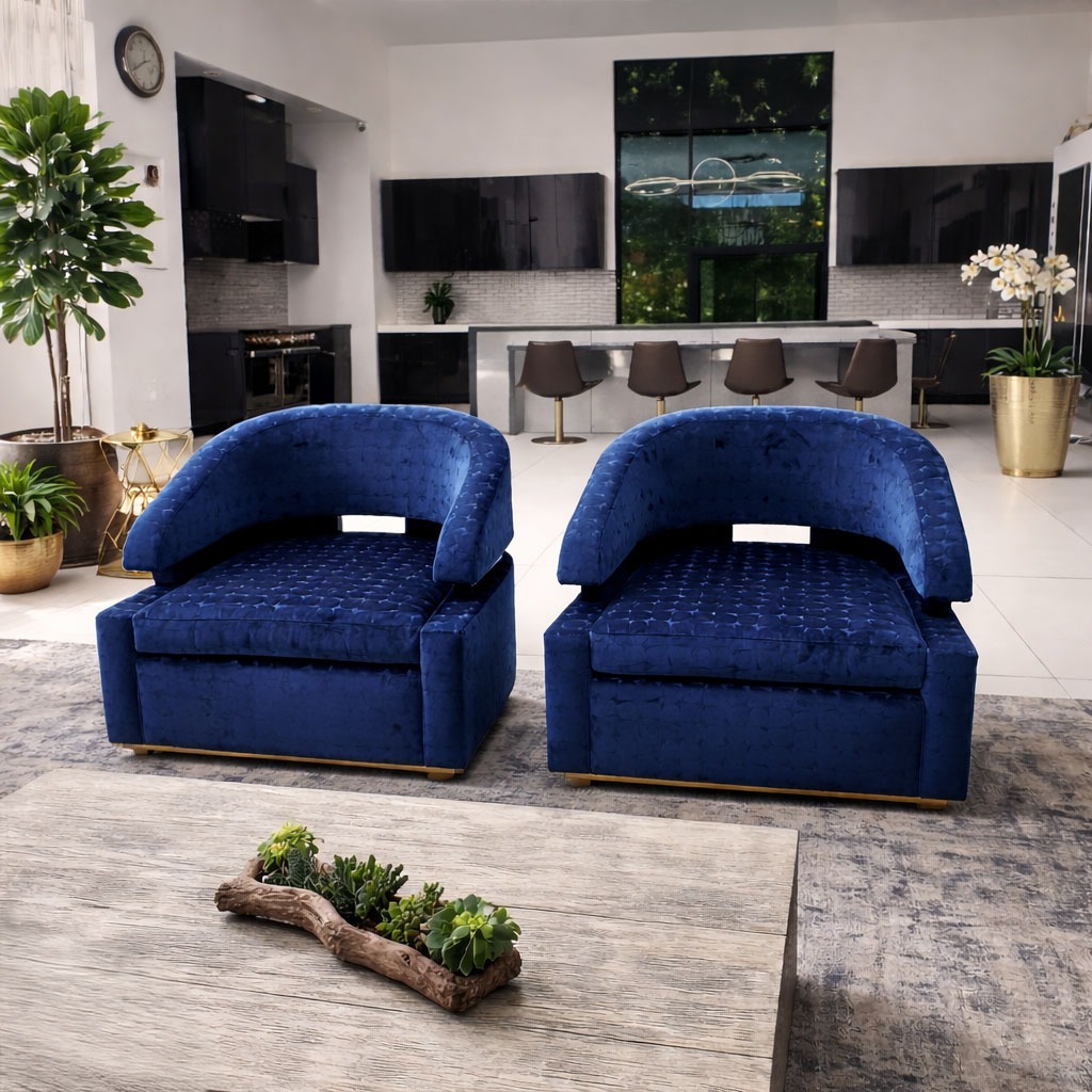 Pair of custom blue upholstered accent chairs with curved backs and matching ottomans