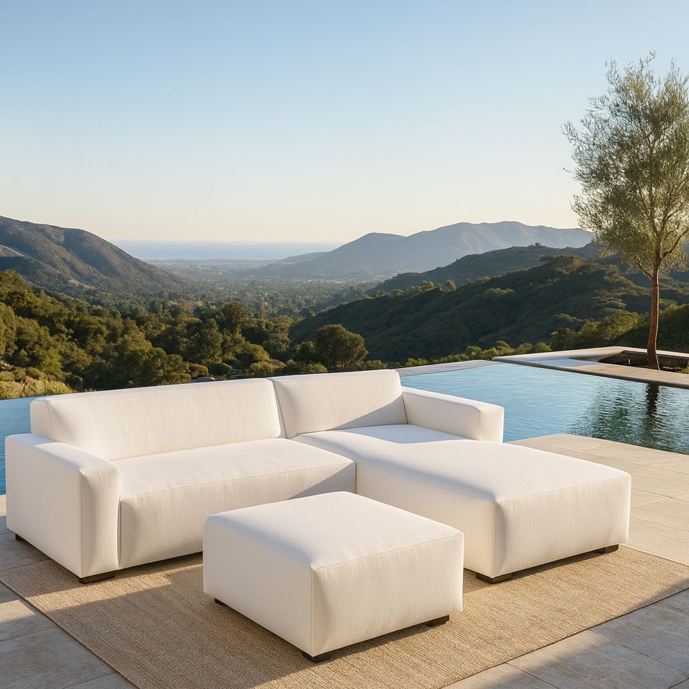 Modern white sectional sofa by Solo Home Decor in a luxurious mountain backyard with an infinity pool and ocean view.