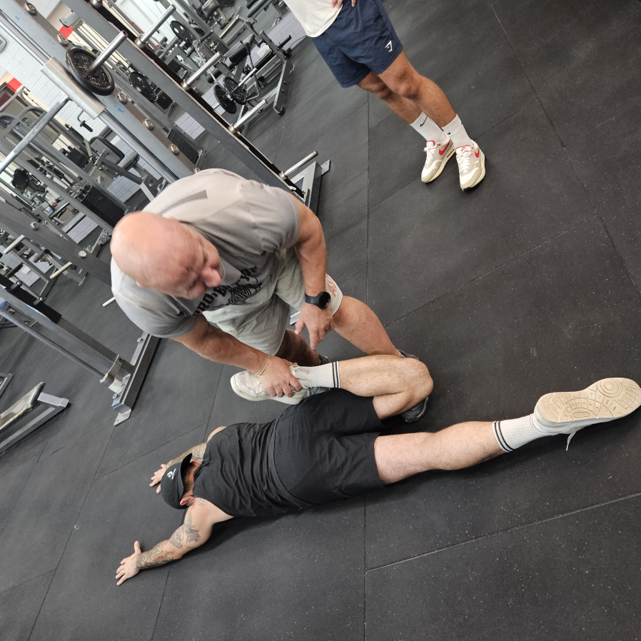 Partner-assisted stretching for mobility in guided end-range work to improve hips an