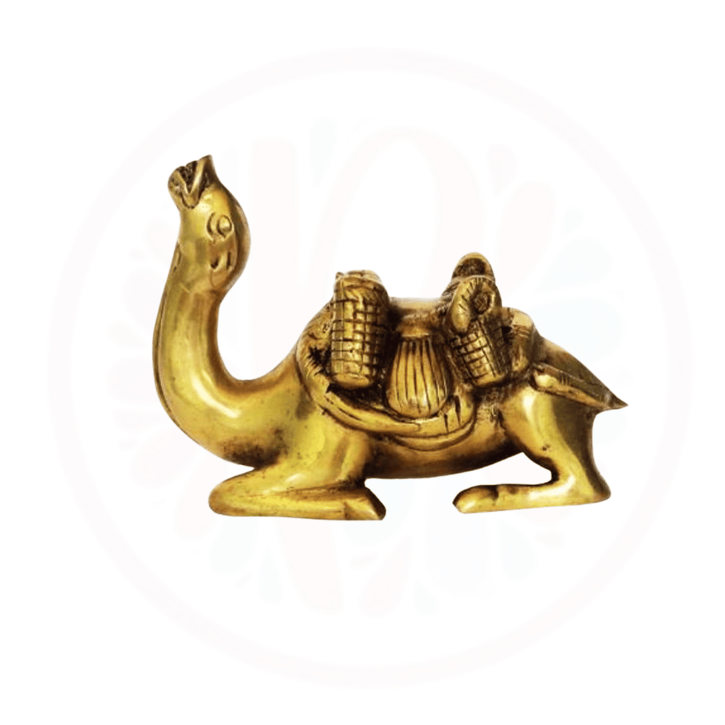 a gold colored camell with a camel in the middle of it