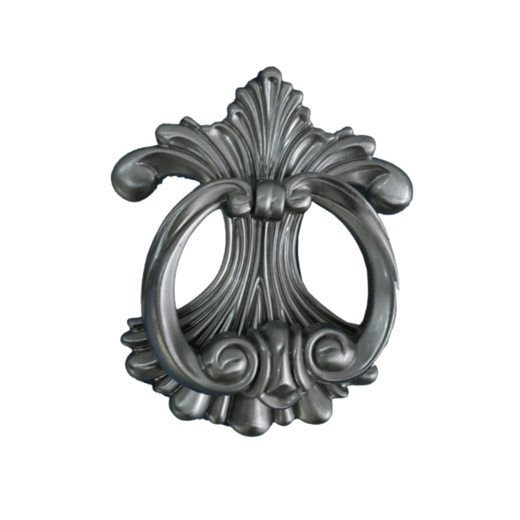 a metal door handle with a decorative design
