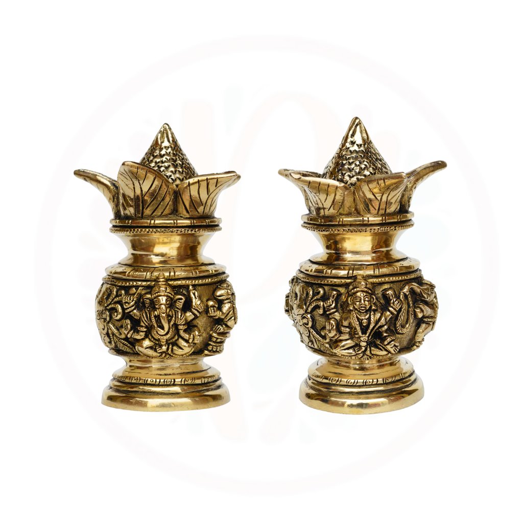 a pair of brass - plated candlesticks