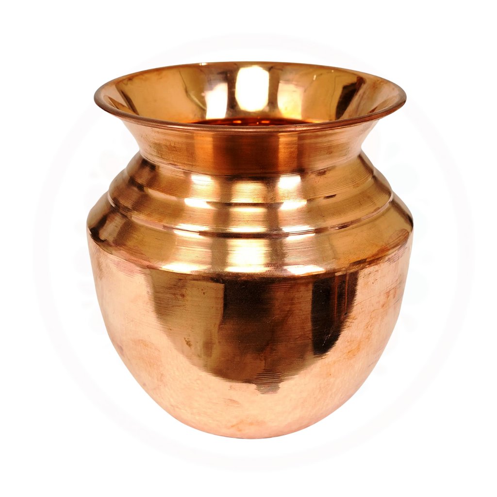 a copper vase with a large metal bowl on it