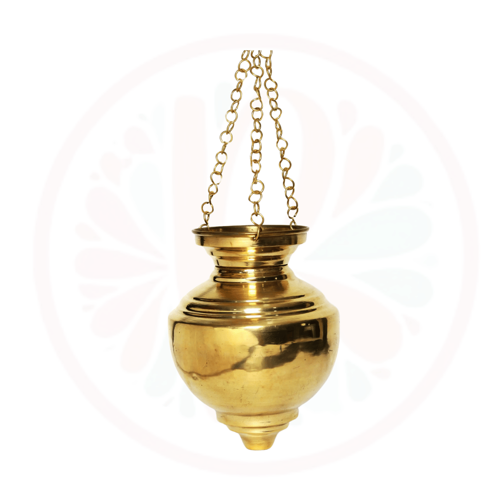 a gold colored vase with a chain hanging from a chain