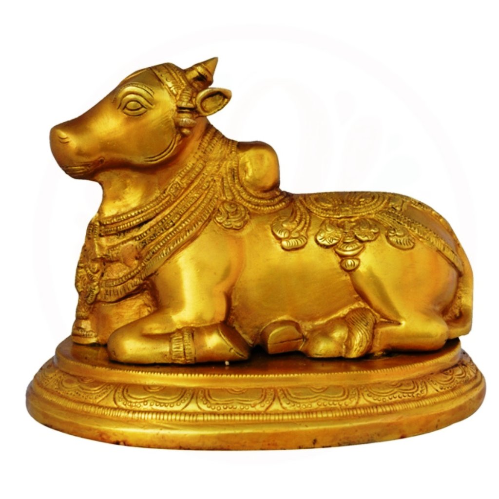 a golden cow statue of a cow in a golden color