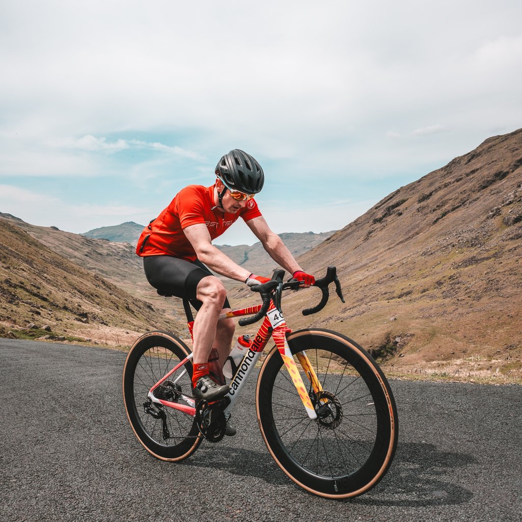a photo of a road cyclist competing in the fred whitton sportive